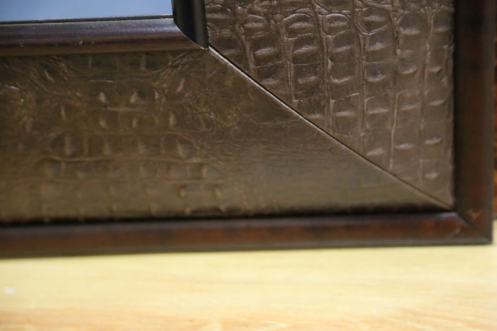 An Andrew Martin faux crocodile rectangular wall mirror, width 116cm height 148cm